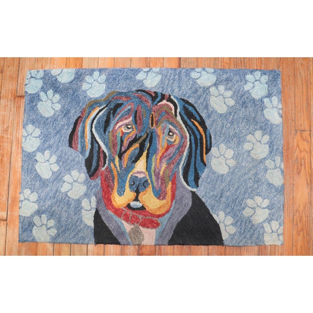 Late 20th century hand-loomed American hooked rug depicting an innocent dog. Measures: 2' x 2'11''.