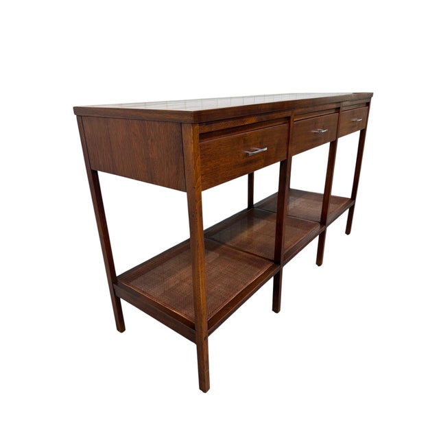 Designed by Paul McCobb for Lane’s highly sought-after Delineator collection, this Mid-Century Modern console table...