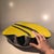 Large free-form, asymmetrical glazed ceramic bowl with a graphic decoration combining a bright yellow crackled glaze with...