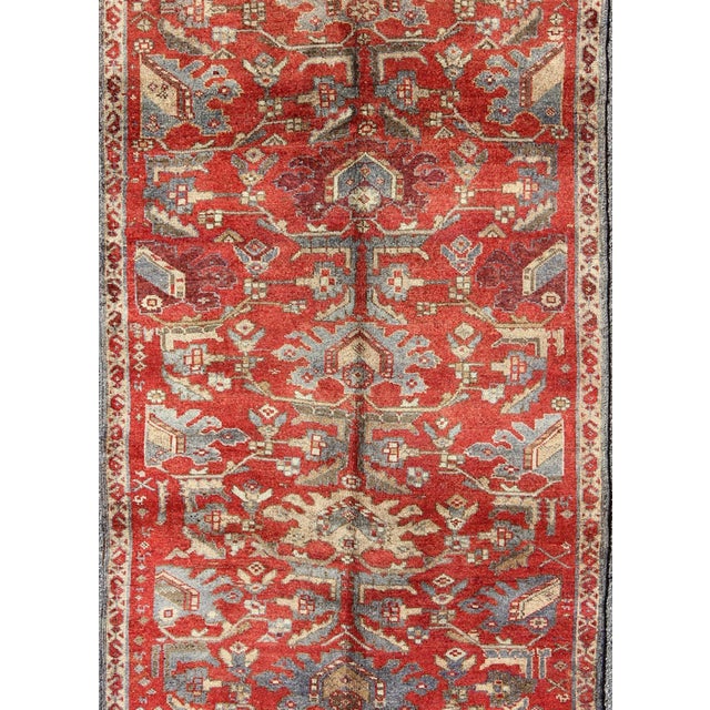 Measures: 4'6 x 10'10 Vintage Turkish Oushak Gallery Runner with Red Field and Blue Accents4'6 x 10'10. Keivan Woven Arts...