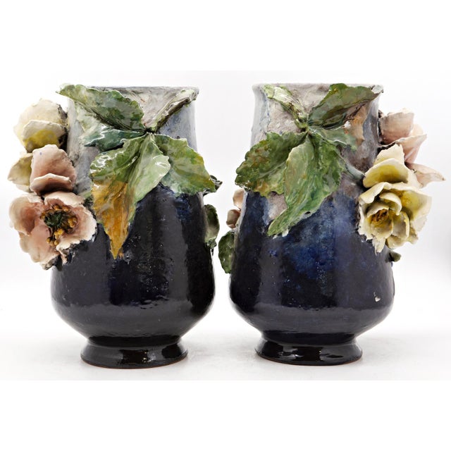 Haviland & co. Manufactory, limoges pair of polychrome painted ceramic vases with high relief floral applications....