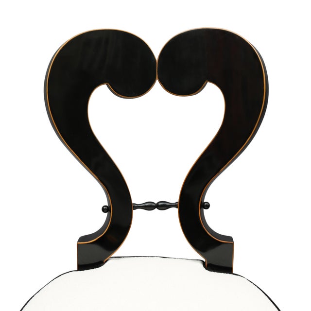 Pair of important Biedermeier side chairs in the manner of Josef Danhauser. Crafted from ebonized fruitwood with border of...
