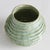 With a reactive glaze and hand finished ribbing detail, this charming sage green vase is a great find. Add a few faux...
