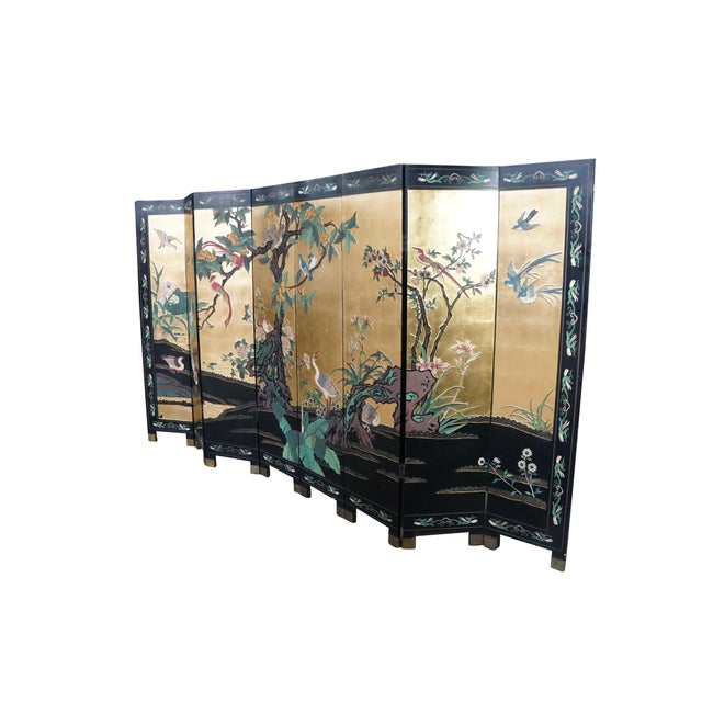 This double-sided vintage Chinese Coromandel eight-panel room divider screen is a striking masterpiece of traditional...