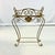 This is a lovely vintage plant stand. It features a seashell front and center and its metal construction has detailed...