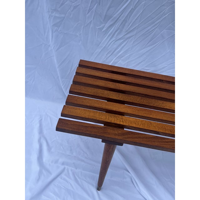 Classic Mid Century slat bench style coffee table, made in Yugoslavia. The bench features architectural repeating slats,...