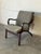 Sculpted bentwood armrests and a gently angled backrest define the relaxed silhouette of this lounge chair. Fluid lines...