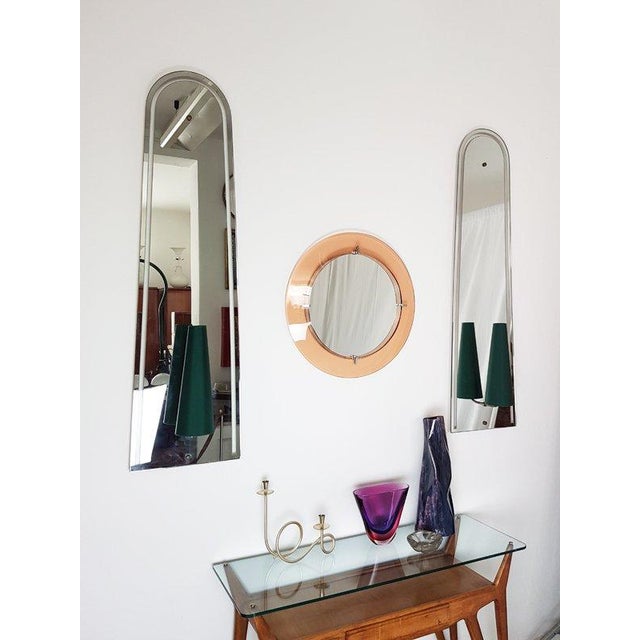 This pair of huge wall lights was produced in Italy, circa 1950s. A solid wooden frame supports the shaped mirrored glass...