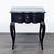This Bernhardt end table features a classic black finish, elegant, curved legs, and a scalloped top edge. The table...