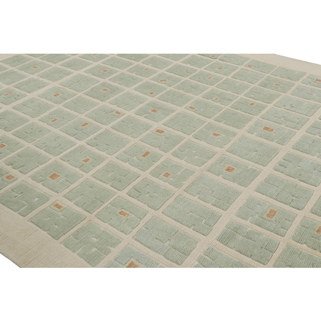 Hand-knotted in wool, this 9x12 modern rug from Rug & Kilim’s French Art Deco rug collection features geometric patterns...