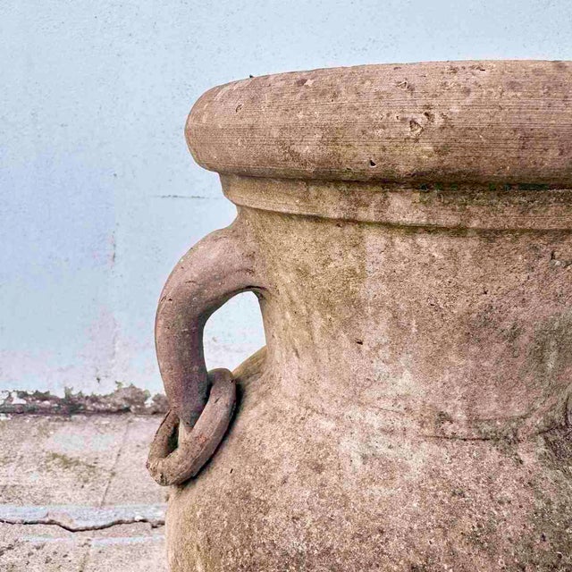 Terracotta pot with double handles, ideal for a rustic touch in the garden Height: 42 Width: 27 Depth: 22. This piece is...