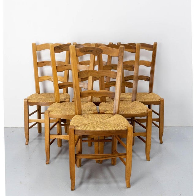 Straw and walnut chairs made in Dordogne. Artisanal work with local walnut, the production of walnuts being one of the...