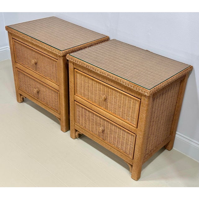 A distinguished pair of rattan nightstands by Henry Link for Lexington Furniture, embodying the quiet sophistication of...