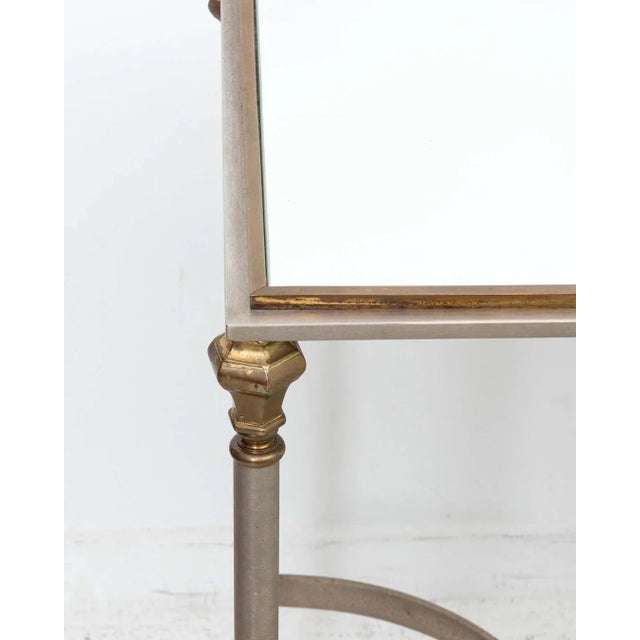 Steel And Brass Console Table with mirror inset top. Original patina present. Some scratches to mirror top. Overall good...