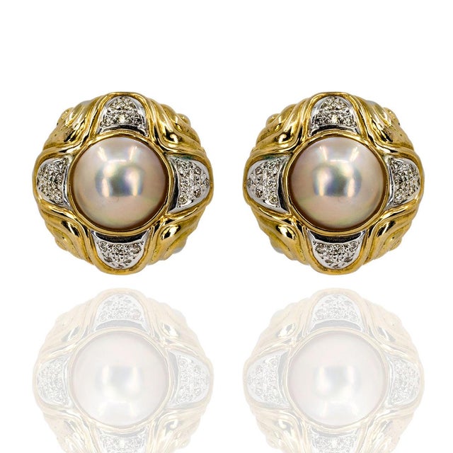 14k Earrings with 2 Mabe pearls and 48 round diamonds weighing approximately 0.50 carats. 24.45 grams