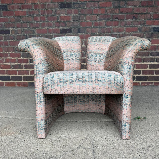This is a pair of Milo Baughman for Thayer Coggin split back lounge chairs. It features a split back, flared arms and the...