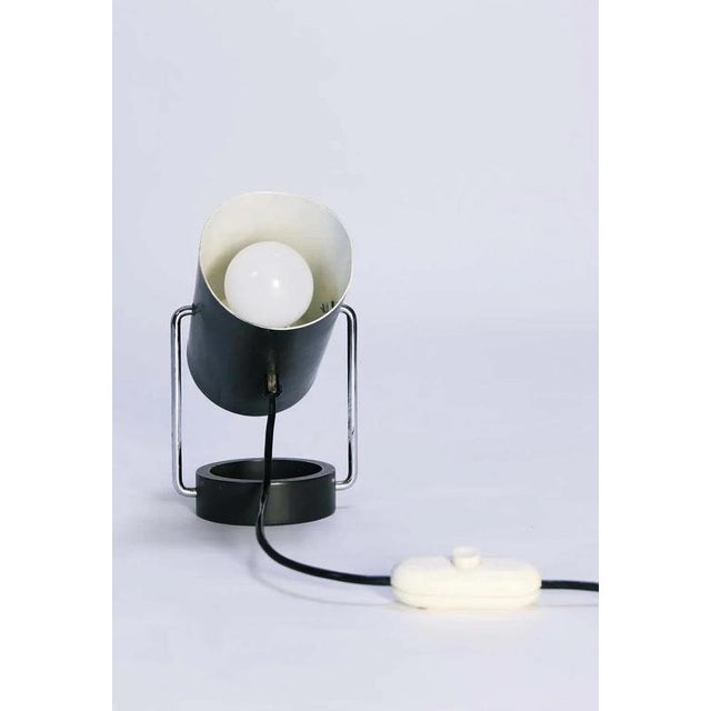 Stunning vintage 1960s table lamp from Tulux, Switzerland. Adjustable tube shade. Chrome and enameled metal. One E27...