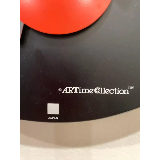 Nicolai Canetti for Art time post modern wall clock. Black enamel background with reds and whites. Sweep second hand....