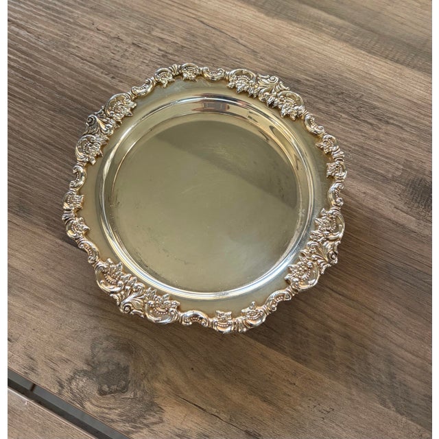 Elevate your tablescape or bar cart with this vintage wine bottle coaster in the iconic "Baroque" pattern by Wallace...