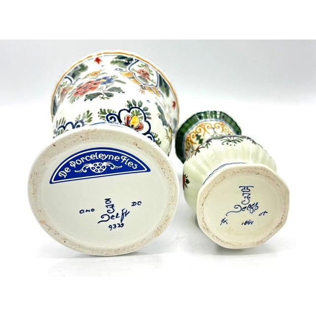 Elevate your collection with this exquisite pair of Vintage Mid-Century Modern Royal Delft Hand-Painted Porceleyne Fles...