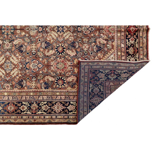 Elevate your space with the timeless artistry of this Vintage Persian Mahal Rug. Hand-knotted from high-quality, lanolin-...