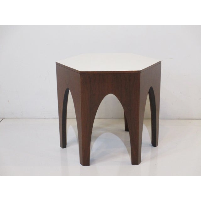 A well crafted Mid Century walnut octagon side / end table with arched legs and a white laminate . The perfect piece next...