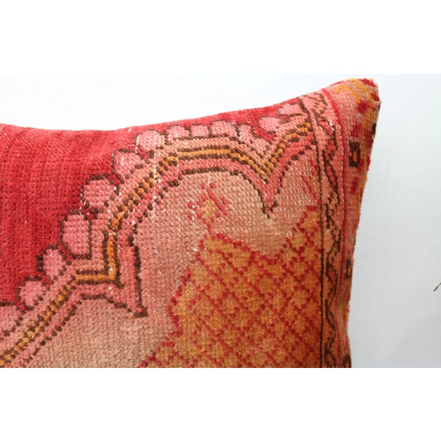 This Turkish pillow cover is made from the highest quality antique rug in 100% wool on the front. The back is covered in...