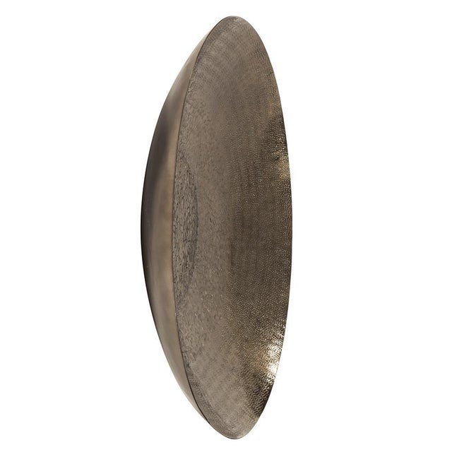 This unique charger is fashioned from metal and features a chiseled texture. It is finished in a metallic deep bronze....