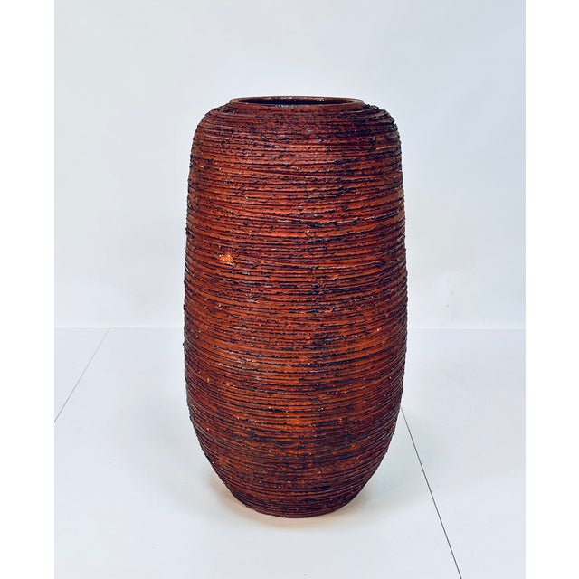 An impressive fire clay ceramic vase, handcrafted in Germany around 1950 at the Spara Keramik workshop. The heavy, high-...