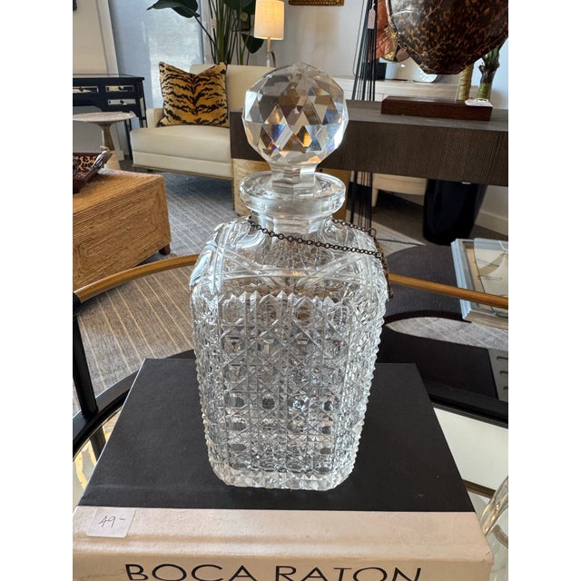Add timeless sophistication to your barware collection with this vintage glass decanter, complete with a sterling silver...