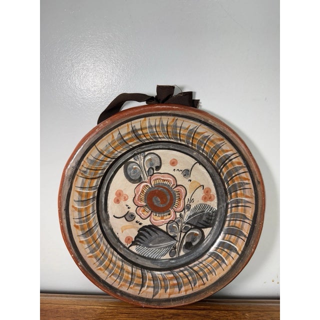 Authentic vintage hand-painted Mexican folk art plate featuring a bold floral design. Stamped “Hecho en Mexico” on the...