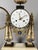Louis XVI Period Portico Clock Portico clock with two white marble columns on a black marble base. Adorned with a gilt...