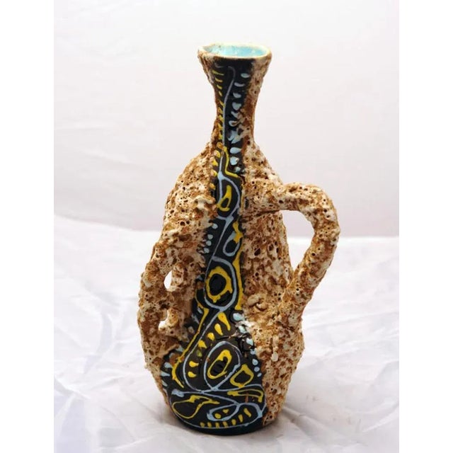 - Mid-century ceramic vase with a very unique lava effect design - Decorations in relief made of glossy glaze on a matt...