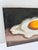 Original still life painting by Jane Palmer featuring a fried egg against a dark, moody background. The compact 5” x 7”...
