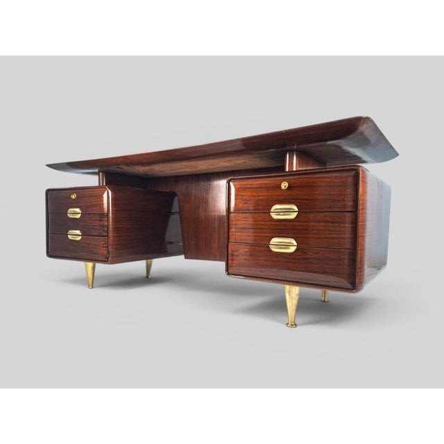 This remarkable Italian executive desk, attributed to Vittorio Dassi and produced around 1957, perfectly embodies the...