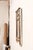 A French Neoclassical period carved-wood mirror, with its original glass and paint, from the early 19th century. This...