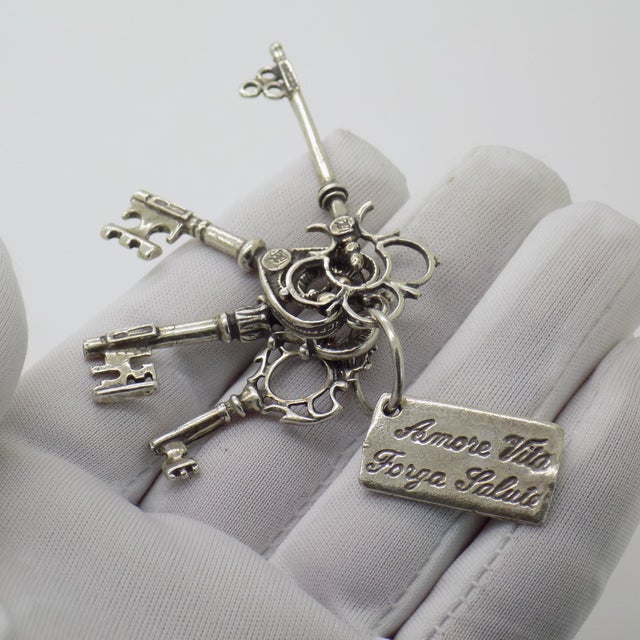 A meaningful vintage set depicting the “Keys to Happiness,” handmade in Continental Silver (800/000) in Arezzo between the...