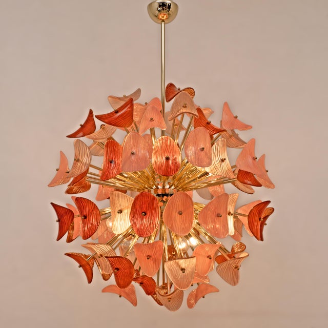 A spectacular contemporary italian sputnik chandelier, entirely handcrafted with an elaborate polished brass frame and a...