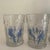 A beautifully hand-painted water or wine pitcher and four matching glasses with flowers and birds.