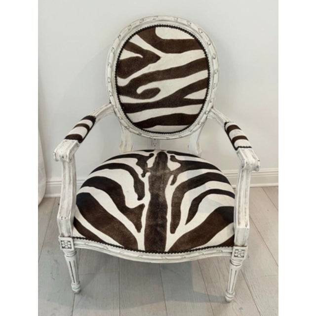 This striking armchair by Oly Studio seamlessly blends classic European silhouettes with bold, contemporary textures....