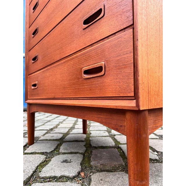 This Danish chest of drawers is a rare and high-quality piece of mid-century design, distinguished by both its...