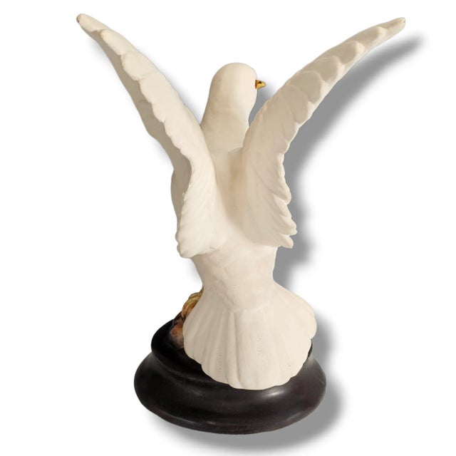 This vintage set of white porcelain Roselane doves figurines captures the essence of mid-century design. The figurines...