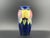 This exquisite 1920's Moorcroft miniature vase features the classic Wysteria and plum decoration, beautifully contrasted...