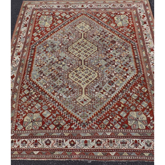 Measures: 5'0 x 6'1 Antique Persian Shiraz Rug with Geometric Tribal Design and Rich Color Palette 5'0 X 6'1. Keivan Woven...