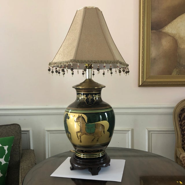 Gorgeous chinoiserie table lamp with equestrian horse Details. Beautiful shine to it and a great addition to any space.