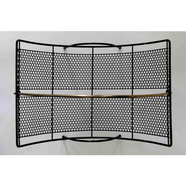 Vintage mid century modern black perforated metal magazine rack. Lightweight scoop shape perforated metal.