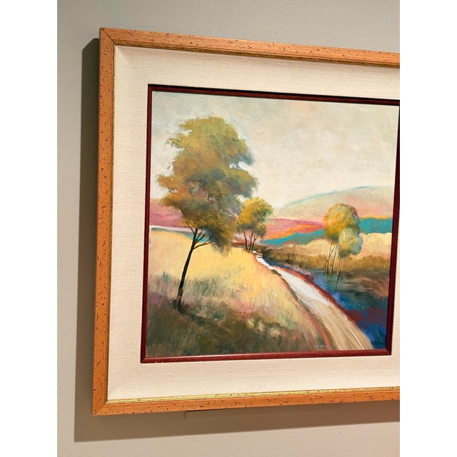 original framed landscape painting by artist R. A. Brandes depicting a serene path or creek alongside trees in soft,...