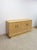This stunning vintage Hollywood Regency blonde parquetry buffet and credenza is a genuinely beautiful and sophisticated...
