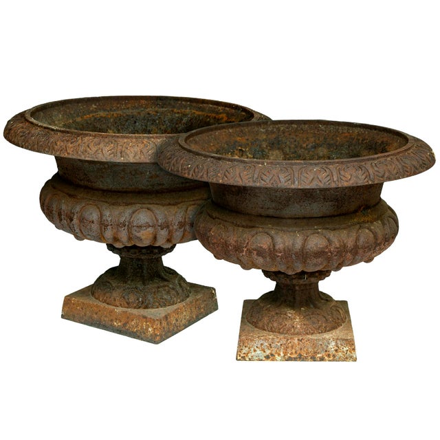 A Beautiful Pair of Rusted CastIron English Garden Urns. Would sit nicely atop a column in the Garden or at the Front Door.