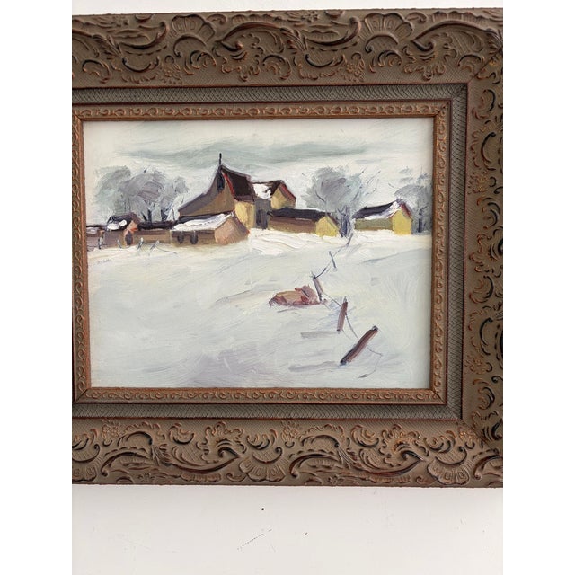 Original vintage oil painting on board depicting a rural farm in winter, with barns, outbuildings, snow-covered fields,...